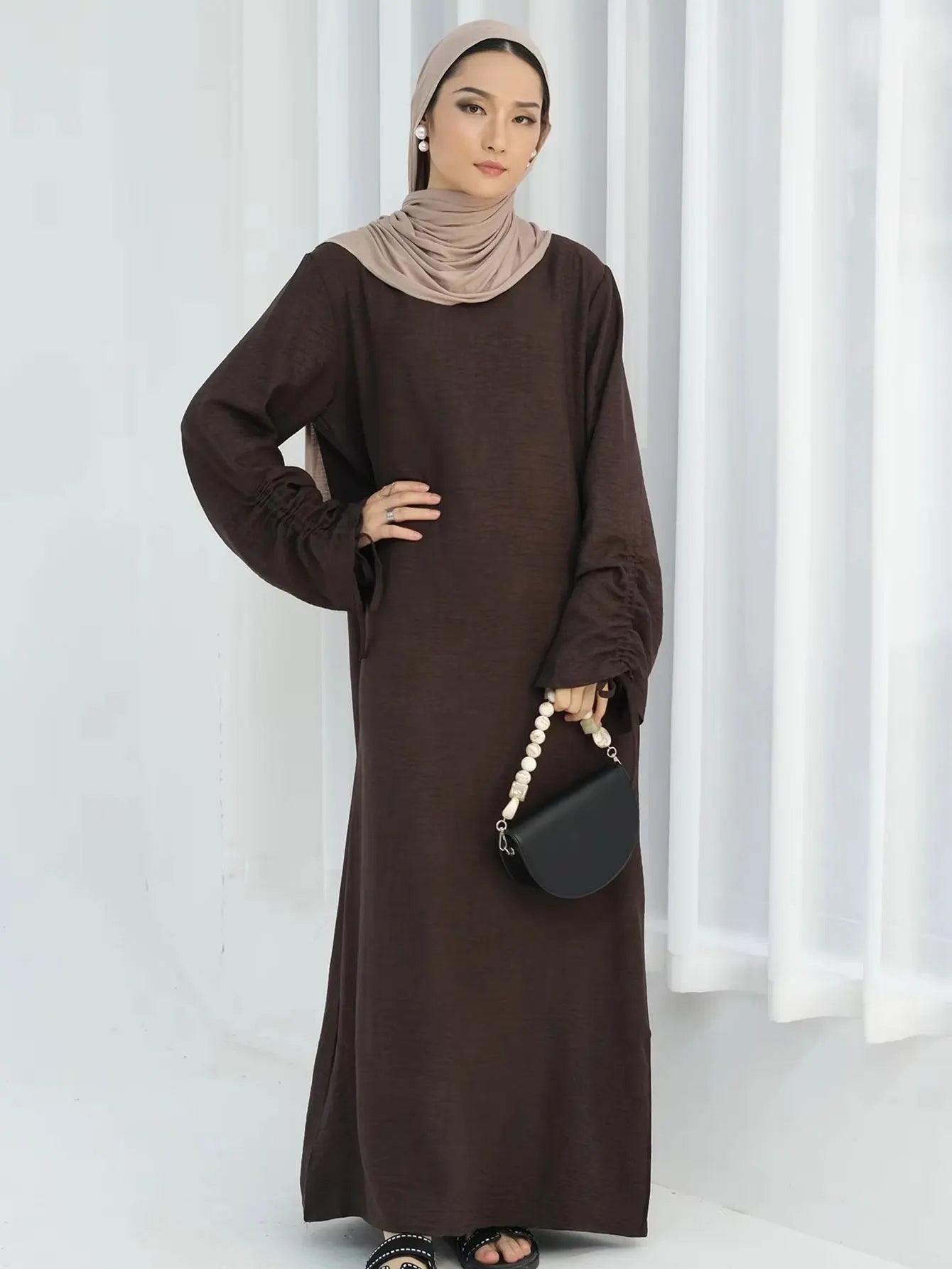 Unveil Your Glow – Luxe Lace-Up Sleeve Abaya for Eid Nights