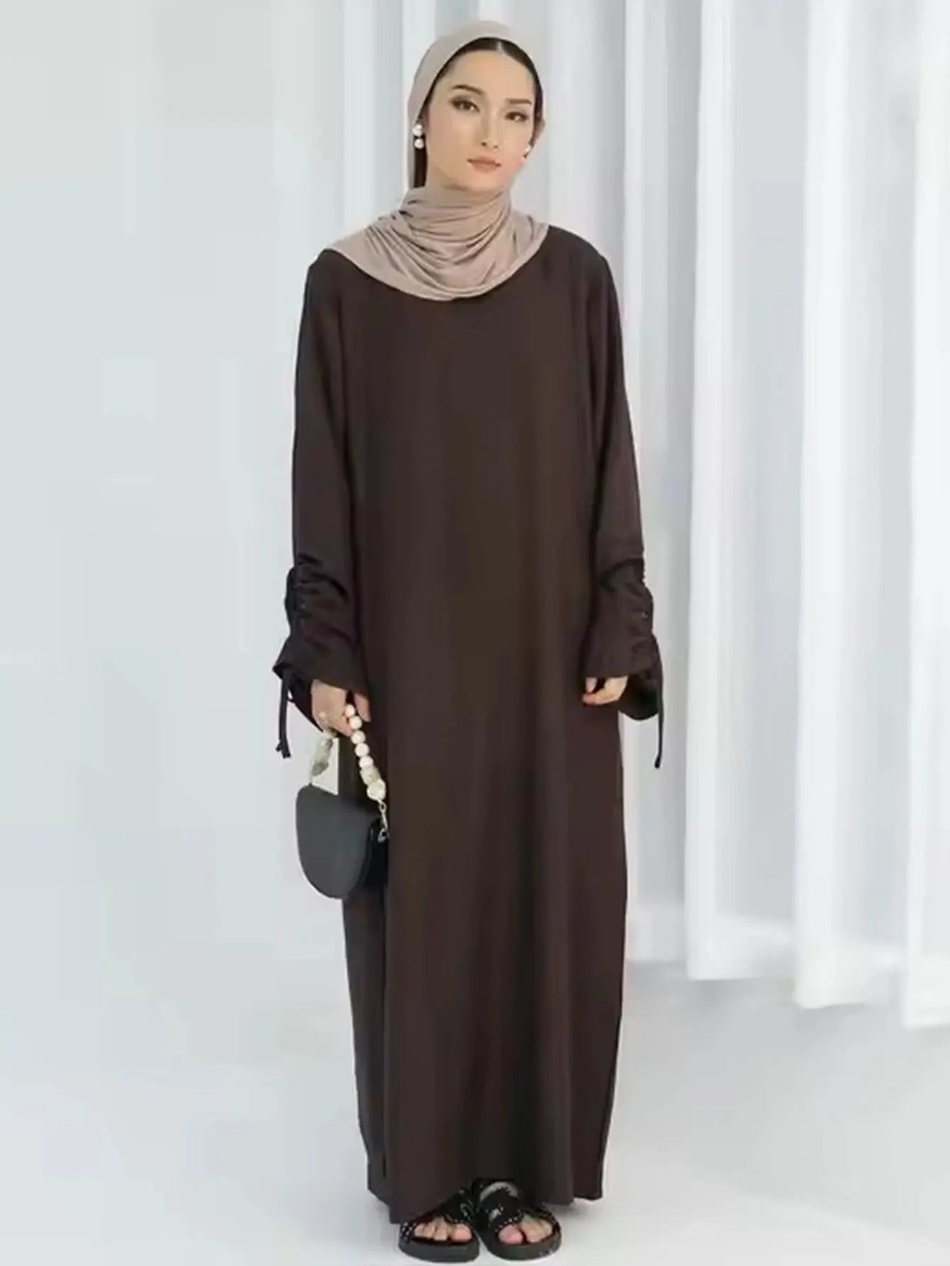 Unveil Your Glow – Luxe Lace-Up Sleeve Abaya for Eid Nights