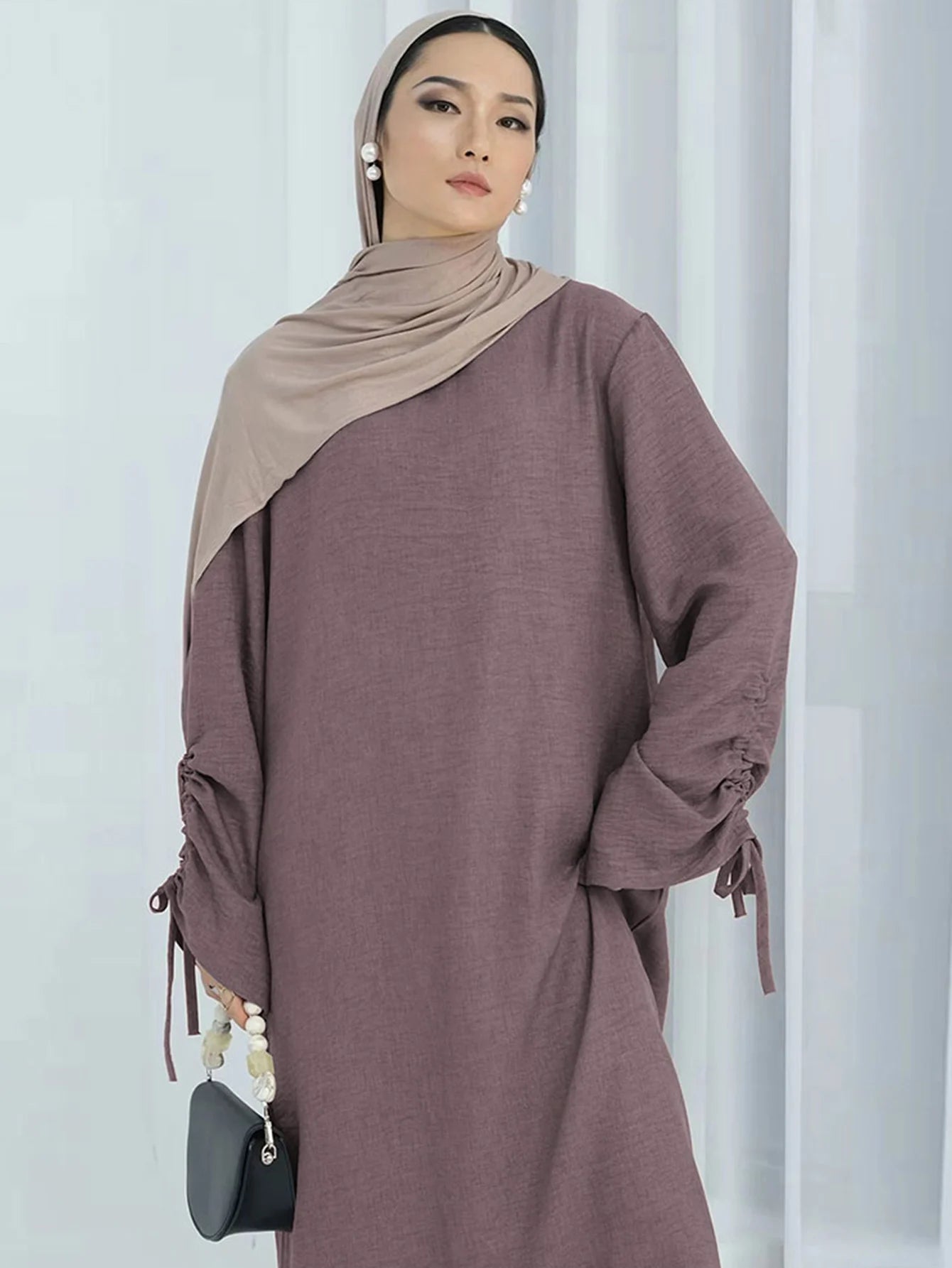 Unveil Your Glow – Luxe Lace-Up Sleeve Abaya for Eid Nights